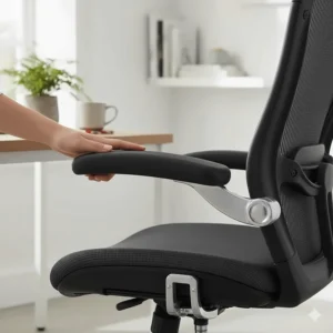 Grey mesh office chair featuring padded flip-up arms and ergonomic back support.