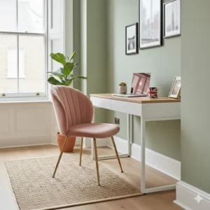 A compact pink velvet desk chair tucked under a slimline desk, perfect for a small UK flat or hallway nook.
