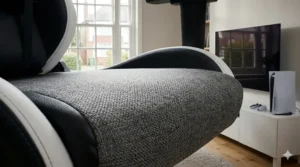 Soft, breathable grey fabric upholstery on a premium gaming chair designed for long PS5 sessions.