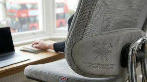 Soft, breathable fabric upholstery on an ergonomic chair, chosen for comfort and temperature regulation for sensitive skin.