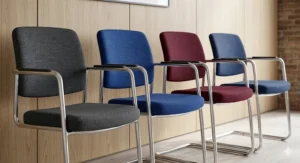 A variety of stackable conference chairs available in charcoal, royal blue, and burgundy for UK businesses.