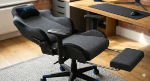 A dark grey fabric gaming chair shown in a fully reclined 180-degree flat position with the footrest extended.