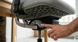 A graphic showing how adjusting armrest height on an office chair helps reduce strain and chronic back pain.