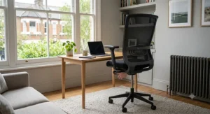 A workstation setup with an adjustable office chair and desk to encourage movement and blood flow to the legs.