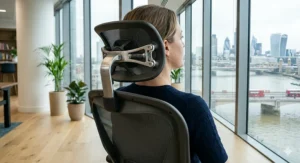A high-back office chair providing essential neck and spinal support for long working hours.