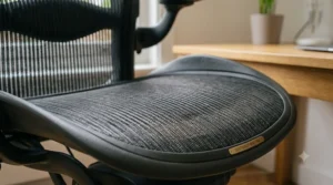 A high-density memory foam seat cushion on an office chair designed to relieve pressure points and alleviate hip discomfort.