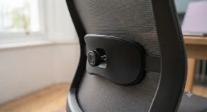 Close-up of the adjustable lumbar support dial on an ergonomic desk chair for personalised comfort.