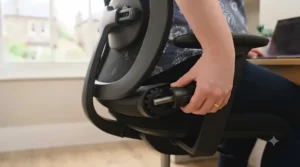 Illustration showing the adjustable seat depth feature on an office chair, customised to support a growing bump.