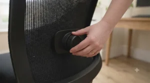 A well-organised home office desk setup with a dedicated ergonomic chair designed for pregnancy comfort.