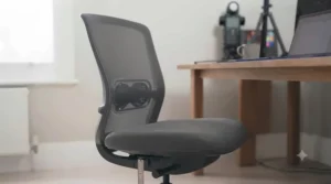 Compact swivel chair tucked neatly under a minimalist desk in a British study room.