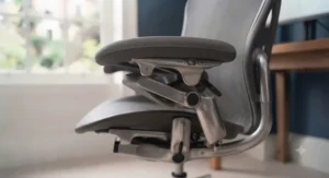 Close-up of 4D adjustable armrests on an ergonomic office chair for tall professionals.