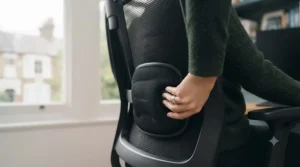 Close-up of an office chair featuring a contoured backrest with built-in lumbar support.