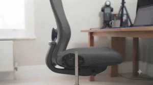 Side profile of a petite ergonomic chair showing the recline and tilt tension control.