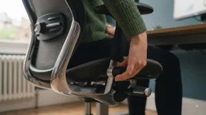 Close-up of adjustment levers and armrests on a heavy-duty XXL office chair for customisable workplace posture.