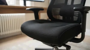 Reinforced steel base and robust gas lift cylinder on a high-capacity office seating model.