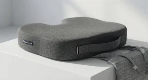 Lightweight portable seat cushion with a carry handle, ideal for hybrid and remote workers across the UK.